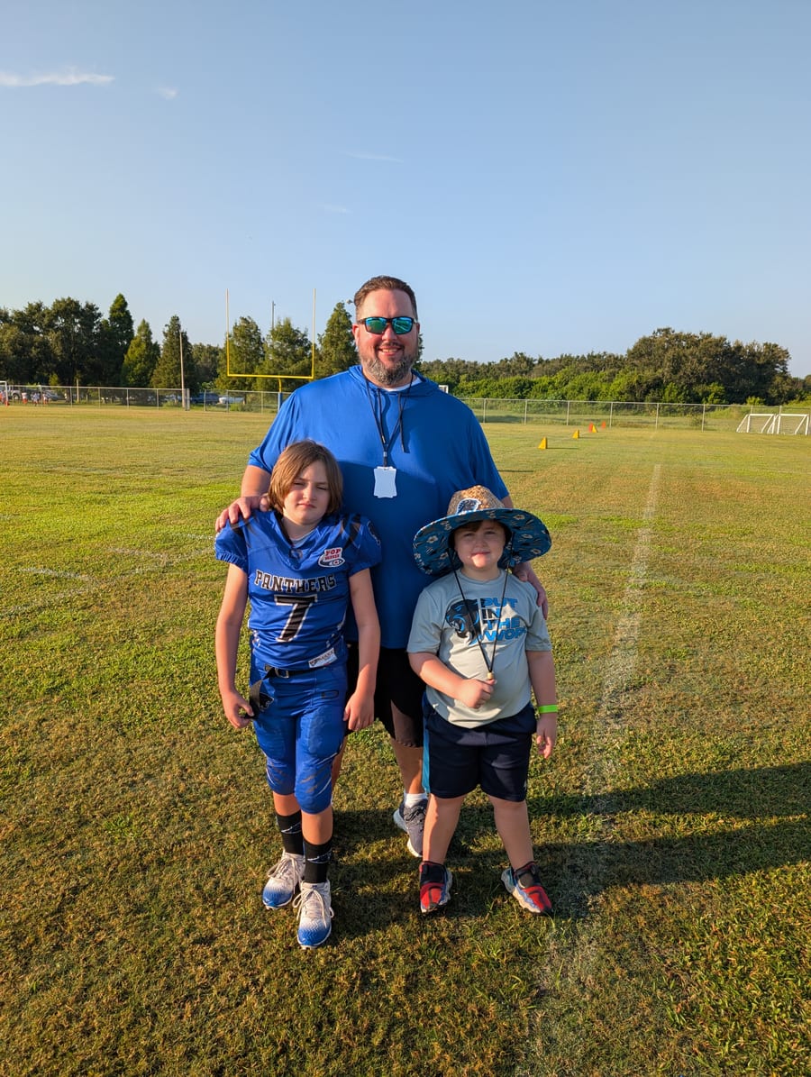 Coach Nick with his two kids at the ballfield